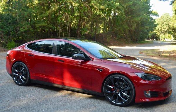 Tesla Model S with window tint, chrome black out, and paint protection film.