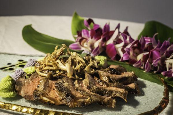 Grass-fed New York steak with Hamakua mushrooms, scallion potato puree and ube puree.