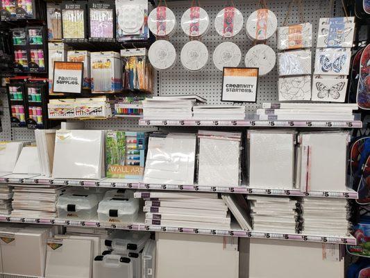 Lots of art supplies including canvas.