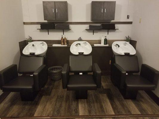 Fully updated shampoo sinks with new chairs.