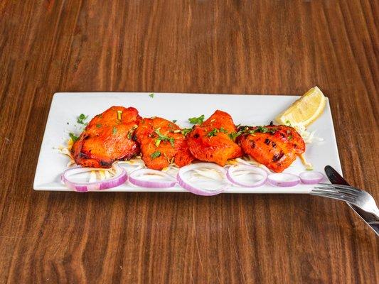 Chicken tikka is a chicken dish originating in the Indian subcontinent during the Mughal era