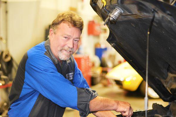 Tolman's Auto-Tech owner, Mark, hard at work. Come see him and the team for your auto repair needs in Allendale, Michigan.