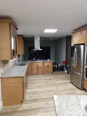 Full kitchen remodel. Demolished two walls, moved electrical, vents,  flooring, cabinets, granite countertops, tile, appliances, painting.