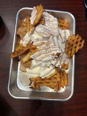 Horseshoe- chicken tenders, waffle fries & white cheese