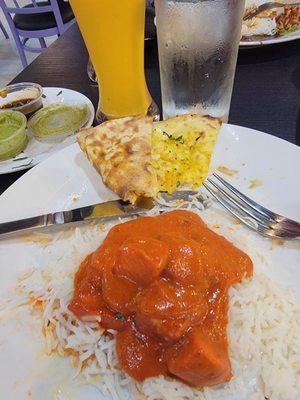 Butter chicken,  garlic cheese Naan, mango lassee.