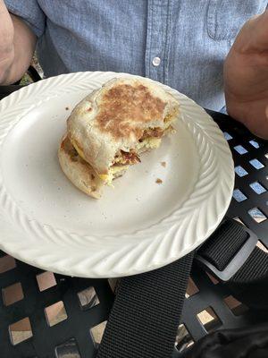 English muffin sandwich with bacon, egg, and cheese