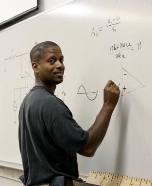 Math tutoring at the whiteboard.