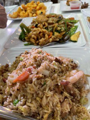 Yummy deluxe fried rice with chop suey and walnut shrimp in the background.