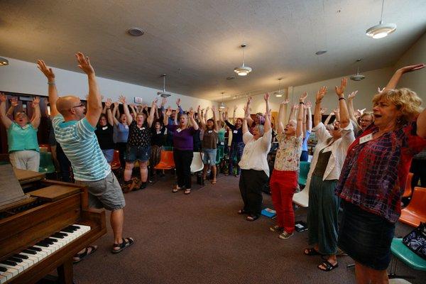 Getting warmed up at our singing retreat.