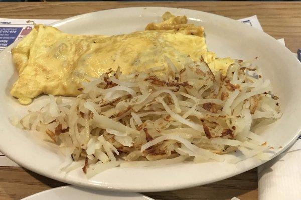 Corned beef hash omelet with home fries.