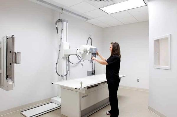 X-Ray machine being operated by licensed radiographers