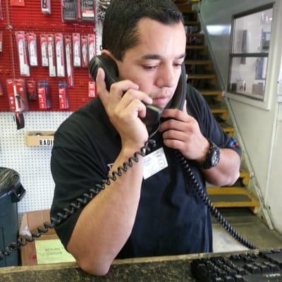 The best salesman hustling two calls at the same time to get things handled.