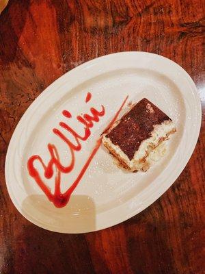 Tiramisu -- Three layers of lady fingers soaked in coffee and liqueur, filled with zabaglione cream, topped with grated Belgium Chocolate