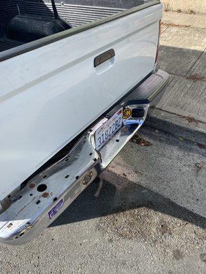 Plastic bumper cover ripped off in car wash.