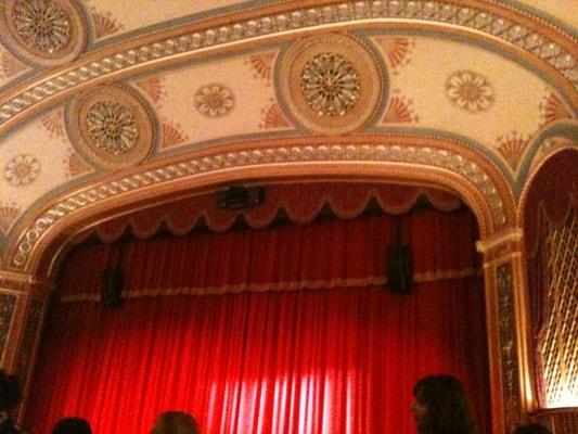 Stage arch with curtain.