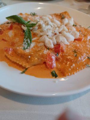 Homemade sundried tomato and smoked mozzarella blush sauce crabmeat topped ravioli.