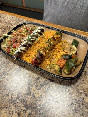 Kofta and chicken kababs, salad, rice and veggies