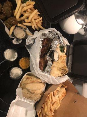 Half chicken meal, shawarma sandwich, falafel meal, fries, Tandoori bread, garlic Charcoal Sauce, Zu sauce