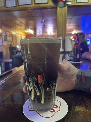 Guinness Draught Can in ice cold glass