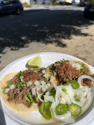 Two asada tacos with mild salsa.