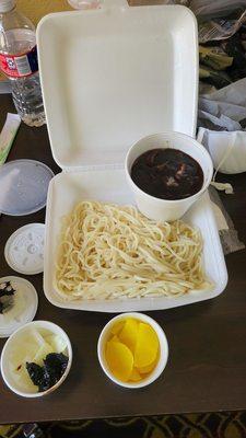 Noodles with black bean sauce and side condiment  to eat in between. See review.