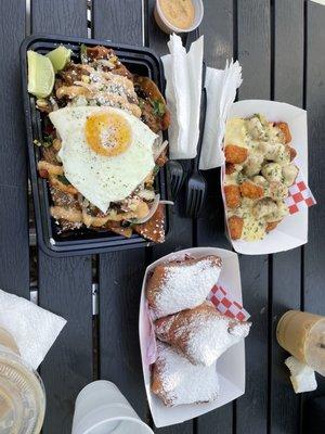 Birria Chilaquiles, loaded Cajun seasoned tots w/ hatch chile cheese & beignets