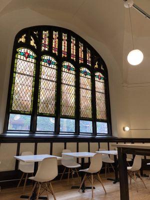 Stained glass windows and seating.