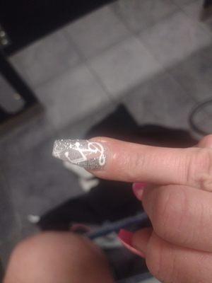 Supposed to be my silver Chrome accent nail. The artwork is terrible