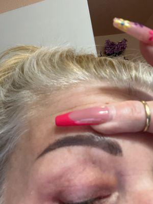 right eyebrow. If you look at it, you could see spots where the instant go. You could also tell that the line on top is not straight