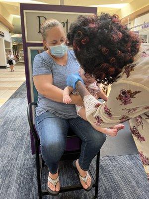 My 4 month old getting her ears pierced