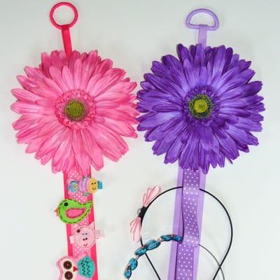 Blooming daisy headband and hair bow holders.