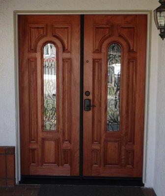 Front entry doors repaired, including surrounding stucco, and reinstalled by Mike and son.