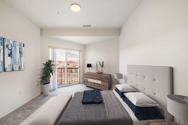 Shoreline Village Apartments in Richland, WA - Bedroom with bright natural light, new carpet and white walls.