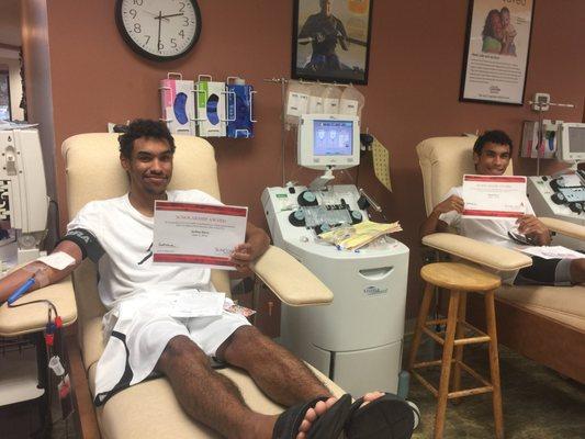 Seniors scholarship winners donating blood