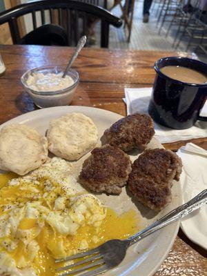 Over easy eggs, sausage and biscuits gravy... cup of coffee too. Outstanding place to eat, best sausage around boss is a hoot