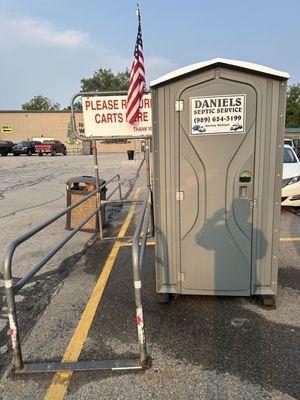 Porta Potty in the parking lot. Boss.