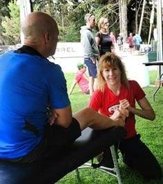 Mari working on an athlete's injured foot at Ironman Canada 2013