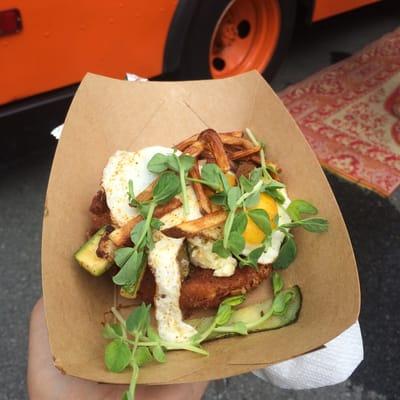 The special - fried tomato topped with arugula, crazy feta, a fried egg, and shoestring fries.