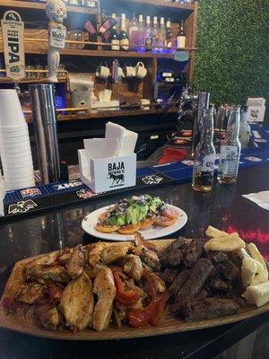 "Parrilla mixta". Grilled chicken and steak, served with yucca and a side salad