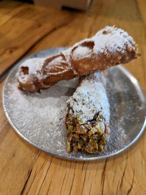 Cannoli. 2 for $7.50. Filled with candied orange, chocolate, and pistachios.