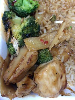 Dinner, made-to-order stir fry with broccoli, bamboo shoots, baby corn, teriyaki chicken, sesame sauce, and brown rice.