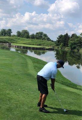 Teeing off on the Par 3 "Island Green" hole, a perfect replica of TPC Sawgrass' 17th in Ponte Verda, FLorida.