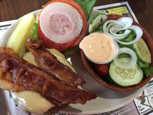 Bacon cheeseburger with a side salad