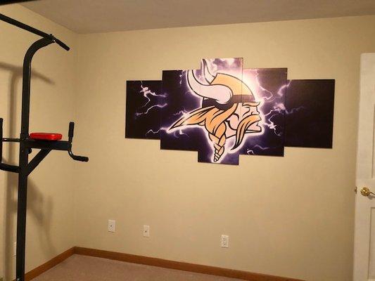 Canvas hung Vikings Logo for our in-home gym room.