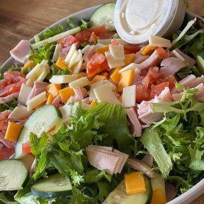 Fresh salads!! Enjoy here or take one to go!