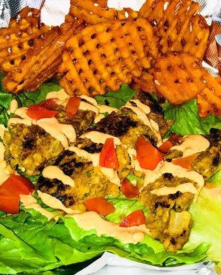 Vegan lettuce wrap with sweet potato waffle fries