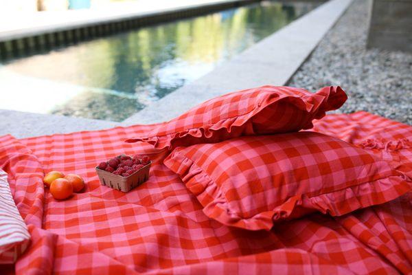 Gingham Guava Beach Towel paired with Gingham Guava Petite Pillows