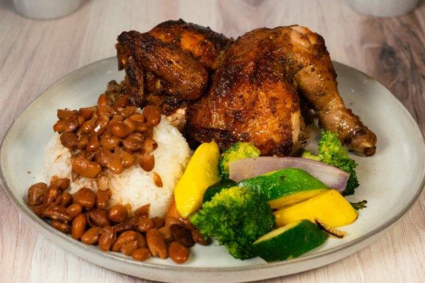 1/2 chicken with rice and beans and freshly sauteed vegetables. Let us cook for you!!