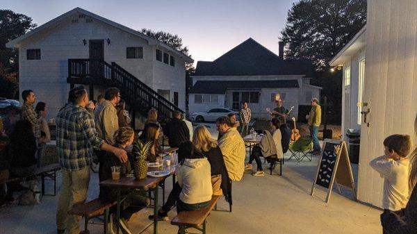 Patio outside the brew barn & bar. Live Music Bathrooms downstairs in building at the left. House in background is a private residence