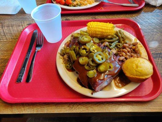 Two meat plate, pulled pork and and pork ribs smothered in jalapenos, with all you can eat sides and salad.